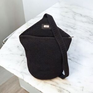 The Sak Black crochet hobo shoulder Sling Bag